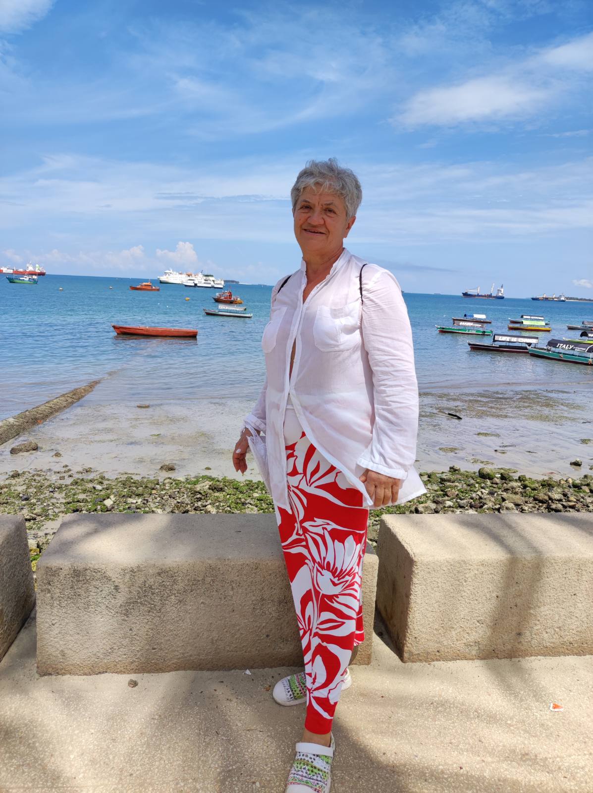 woman doing yoga by the sea